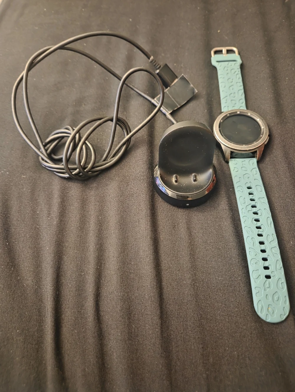 Samsung Galaxy Smartwatch with Teal Band and Charging Dock